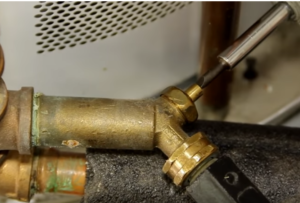  Close the water heater tank drain valve