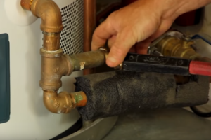 Close the water heater tank drain valve